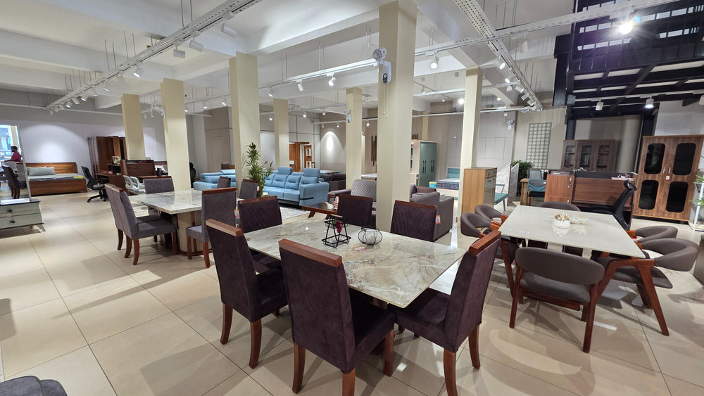 Dining table display at Zodiya furniture store, Mukkam, Kozhikode