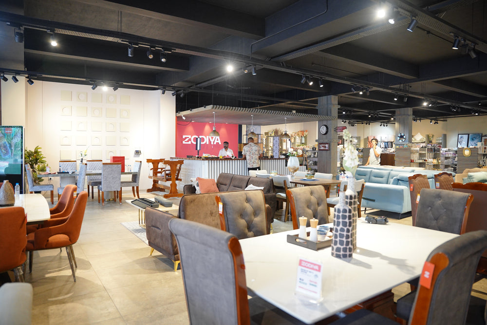 Dining table display at Zodiya furniture store, Podikundu, Kannur