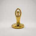 Gold Toned Metal Sculpture by Zodiya